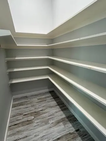 a bathroom with a granite countertop sink a toilet and shower