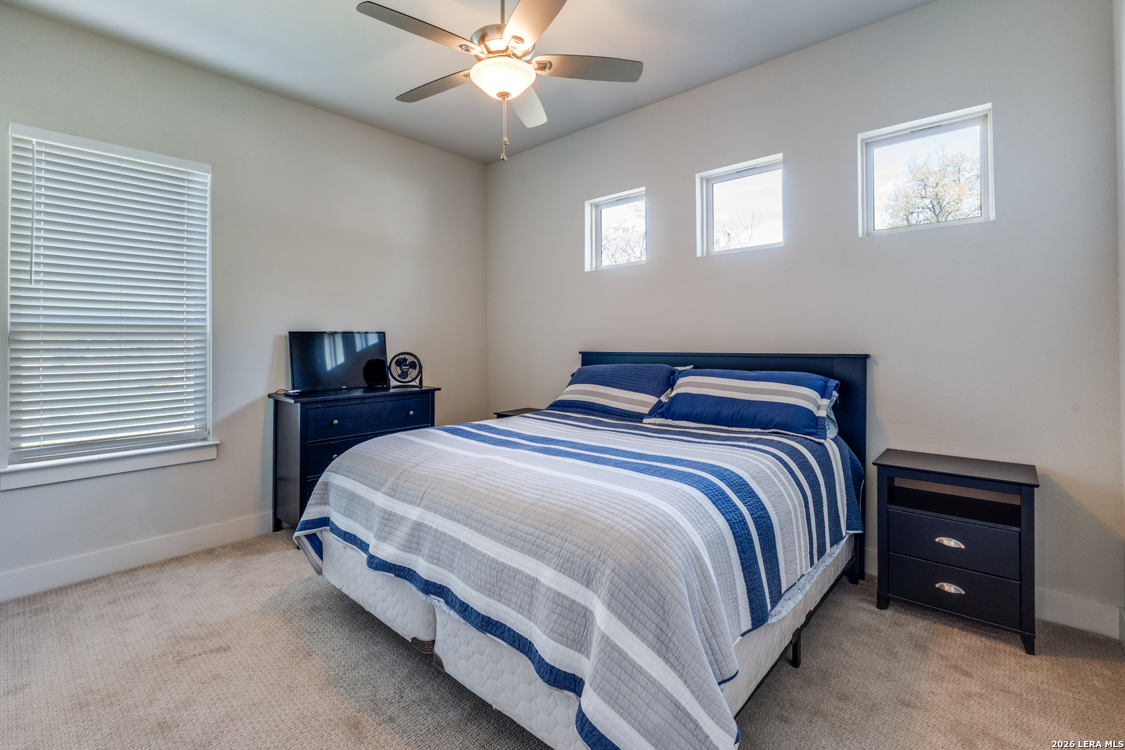 230 Sabella Spring Branch, TX 78070 - Photo 13 of 24 a bedroom with a bed and a chandelier