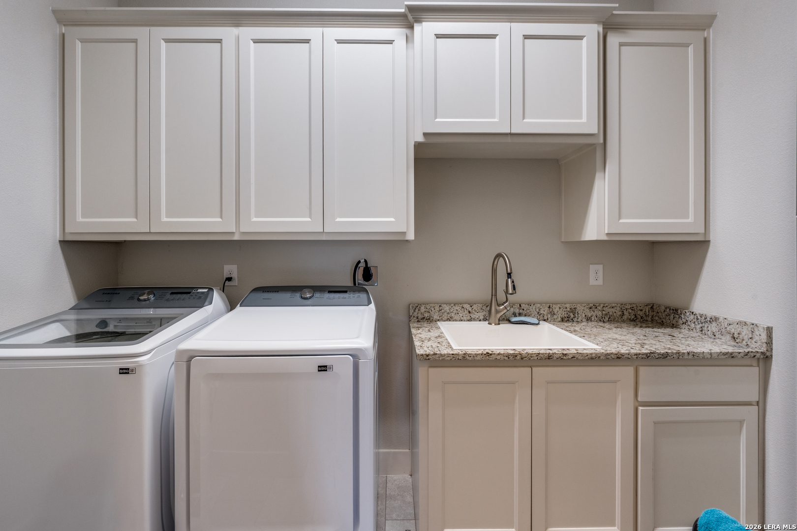 230 Sabella Spring Branch, TX 78070 - Photo 15 of 24 a kitchen with granite countertop white cabinets and sink