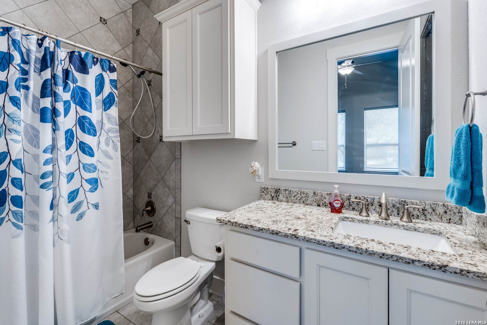 230 Sabella Spring Branch, TX 78070 - Photo 21 of 24 a bathroom with a granite countertop sink toilet and shower