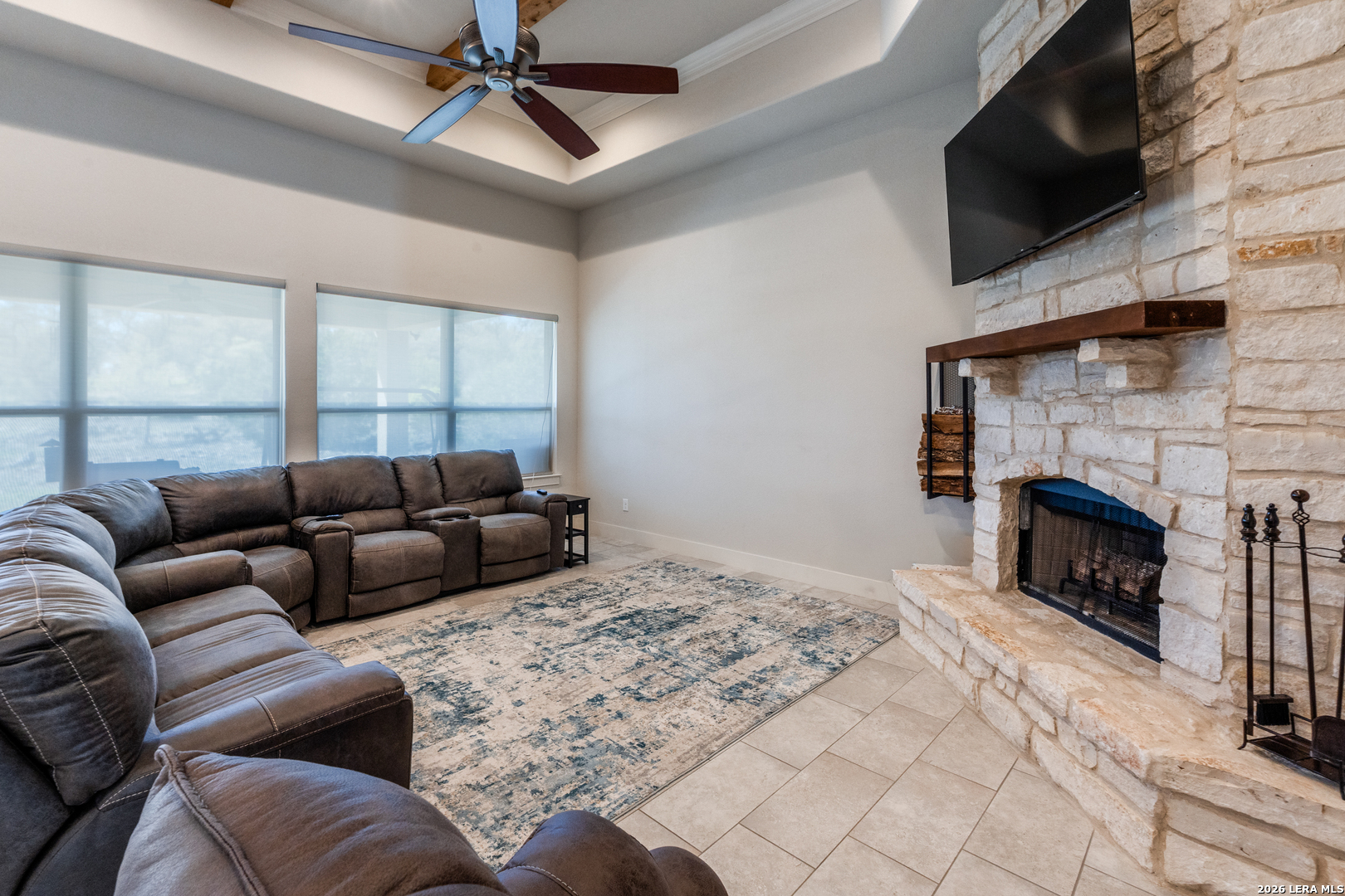 230 Sabella Spring Branch, TX 78070 - Photo 5 of 24 a living room with furniture a flat screen tv and a fireplace