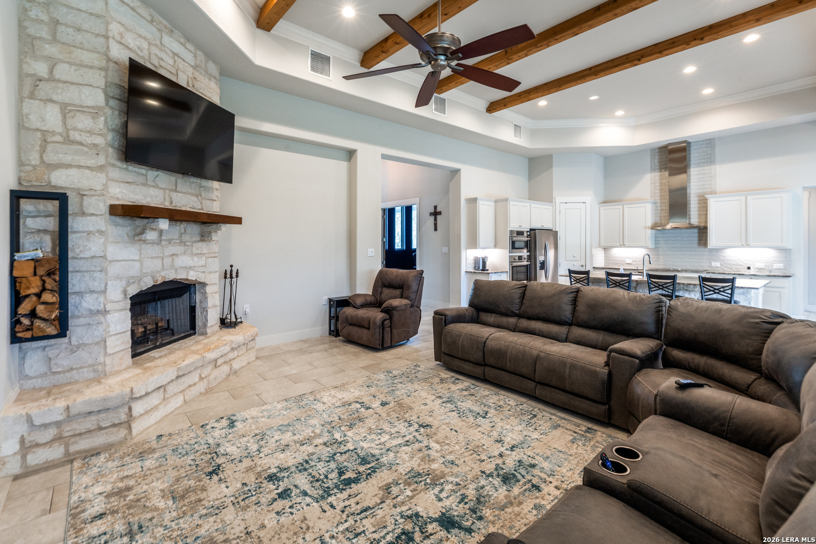 230 Sabella Spring Branch, TX 78070 - Photo 6 of 24 a living room with furniture a flat screen tv and a fireplace