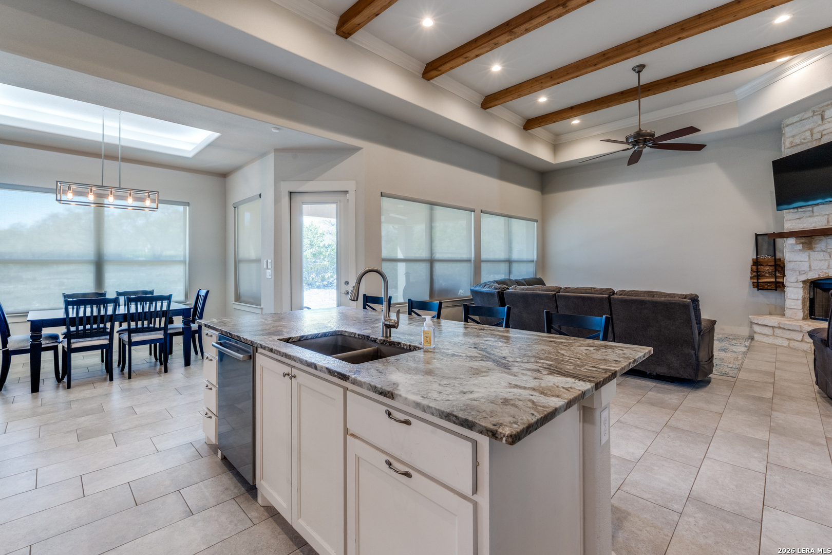 230 Sabella Spring Branch, TX 78070 - Photo 8 of 24 a kitchen with granite countertop a table chairs sink and cabinets