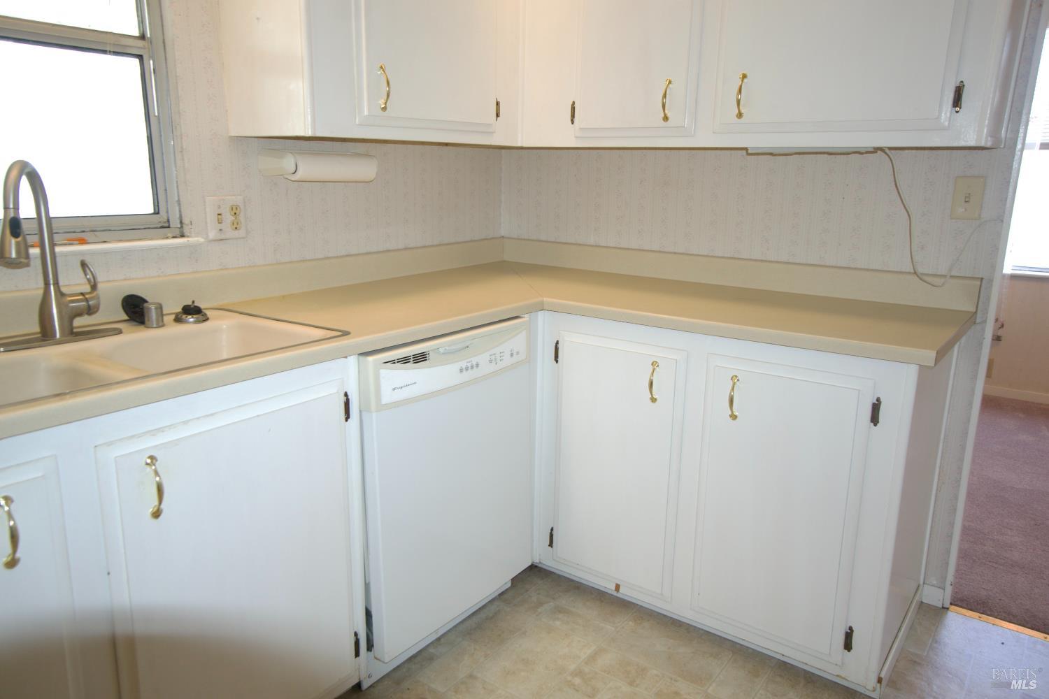 529 Colonial Park Drive Santa Rosa, CA 95403 - Photo 12 of 27 White cabinets and dishwasher