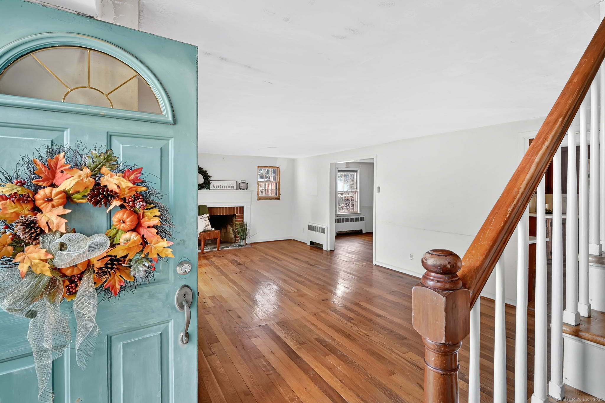 a view of hall way with furniture