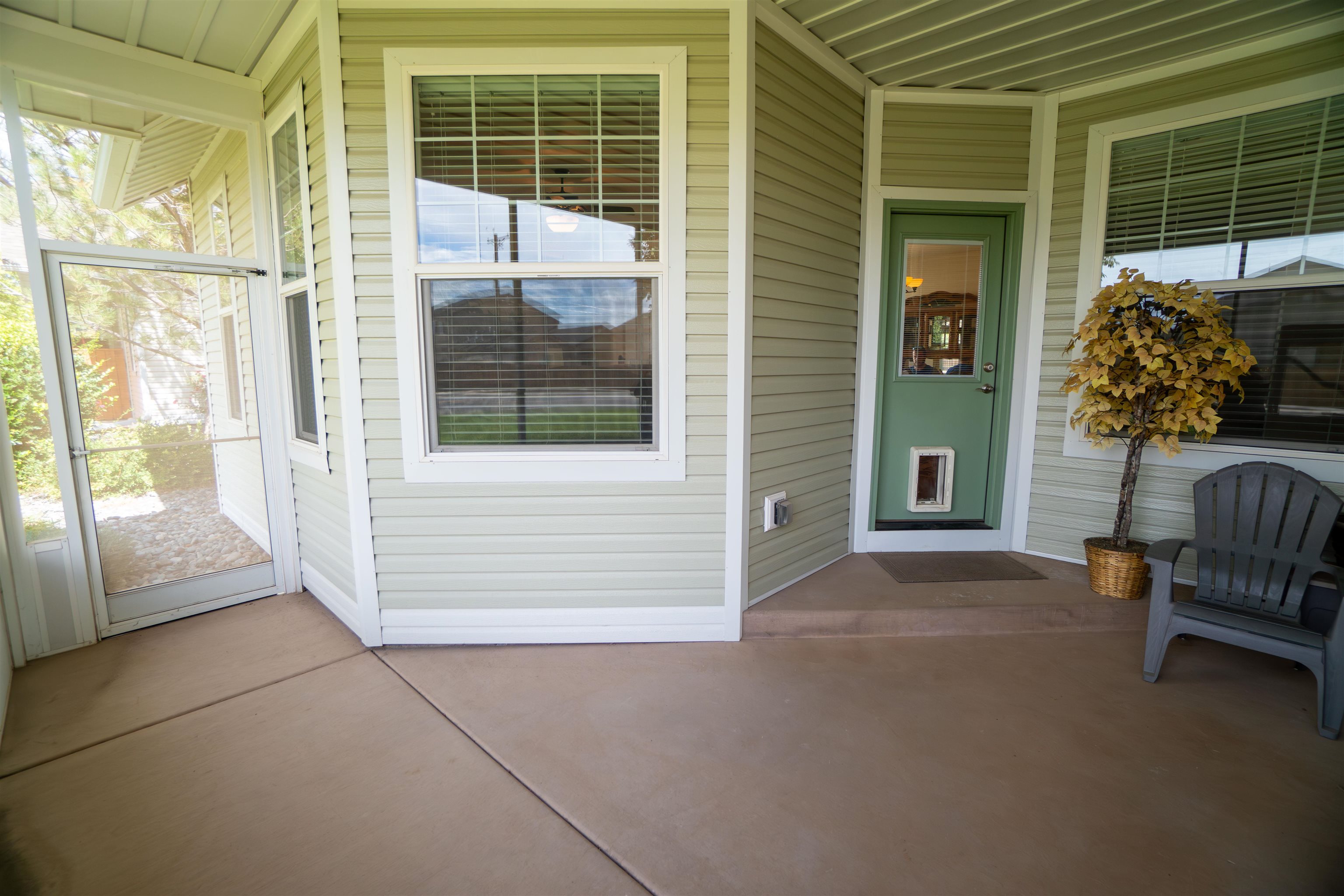 1111 Daisy Lane, Unit 32 Fruita, CO 81521 - Photo 22 of 23 a view of front door and porch with furniture