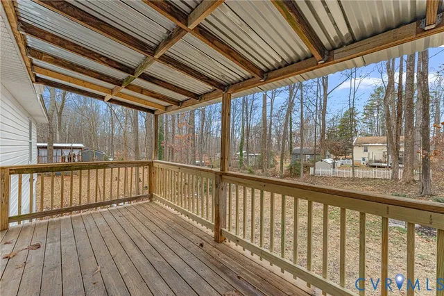 a view of a balcony with wooden floor