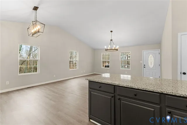 a view of a kitchen counter top space and wooden floor