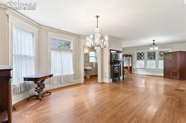 a white kitchen with granite countertop stainless steel appliances