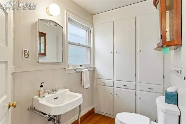 a view of a livingroom with lounge chair and a window