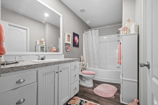 150 West 7500th South, Unit 13 Midvale, UT 84047 - Photo 19 of 32 Bathroom featuring a white vanity with beadboard cabinet doors, a drop-in sink, and a speckled countertop