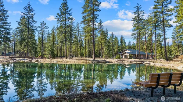 a view of a lake with a house in the background