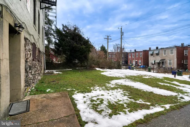 a view of a building with a yard