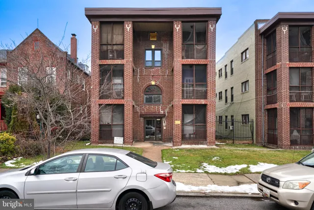 a white refrigerator freezer and a stove sitting inside of a kitchen