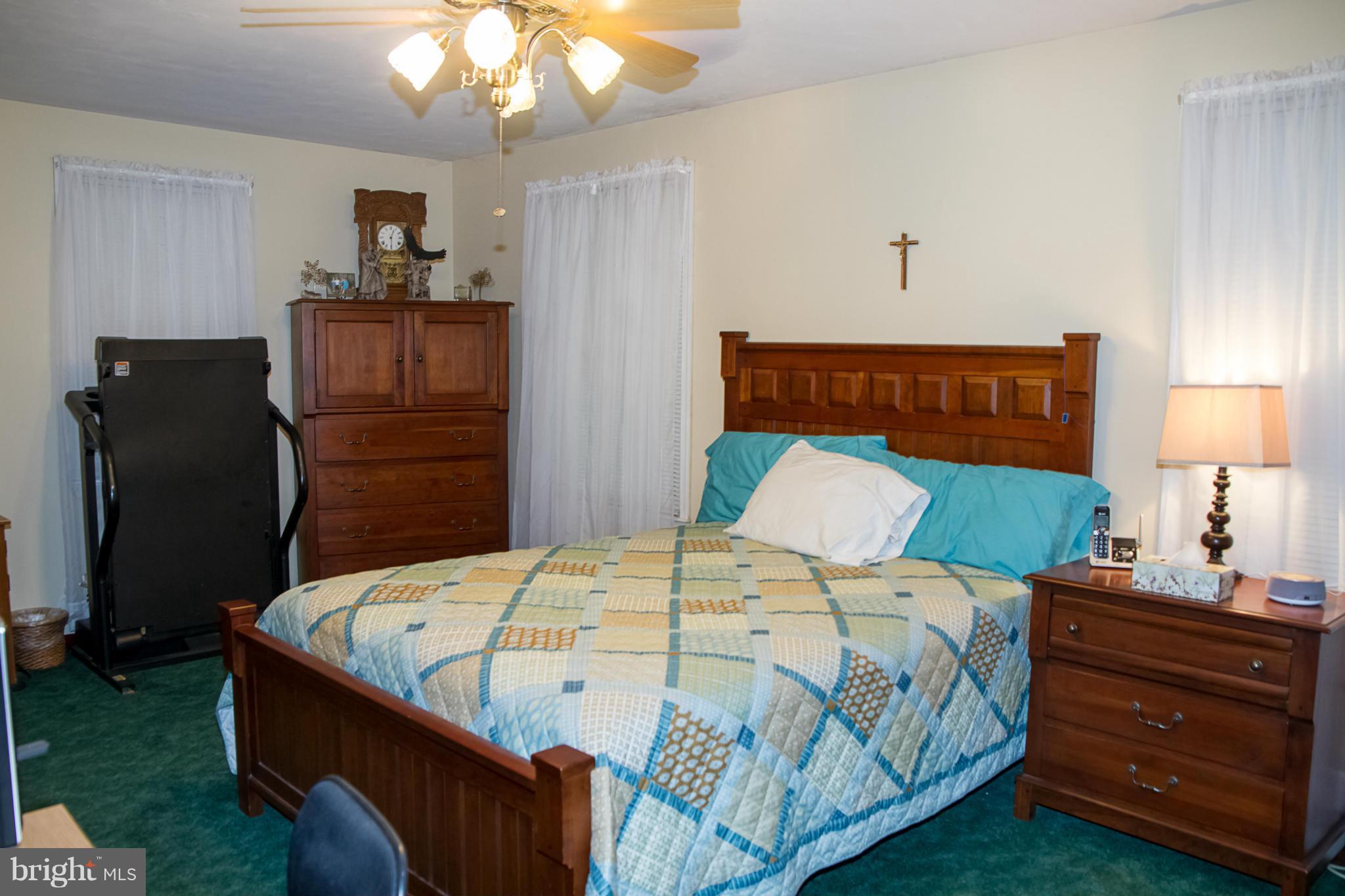 5249 Carroll Warehime Road Manchester, MD 21102 - Photo 11 of 26 a bedroom with a bed and wooden floor