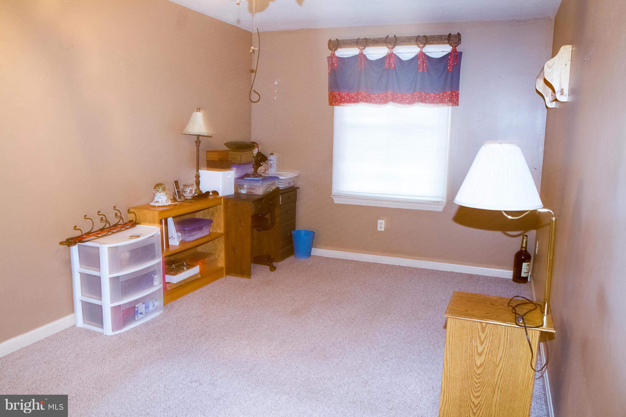 5249 Carroll Warehime Road Manchester, MD 21102 - Photo 14 of 26 a bed room with a bed and a window