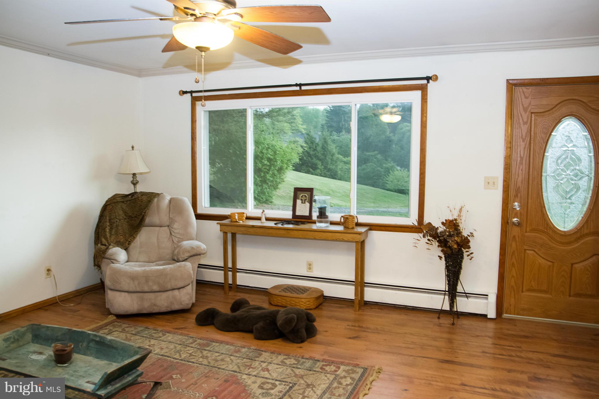 5249 Carroll Warehime Road Manchester, MD 21102 - Photo 18 of 26 a living room with furniture and a large window