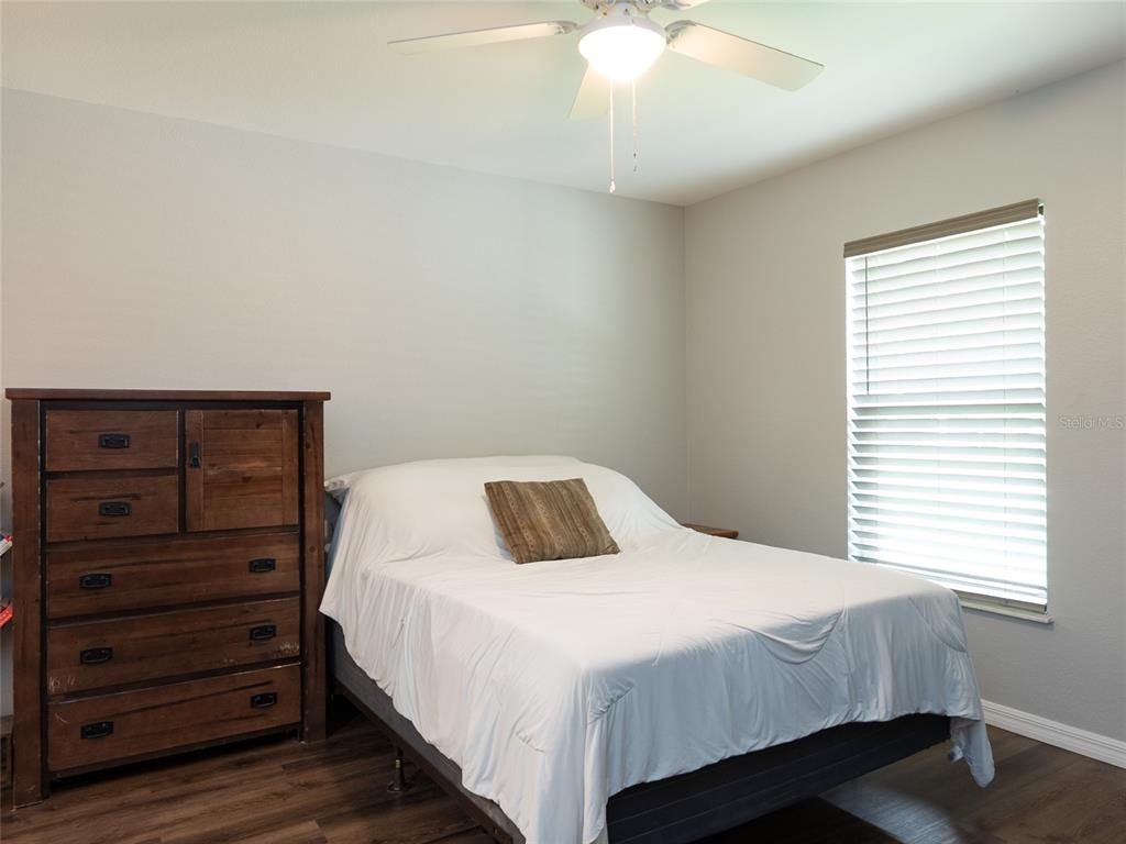 1833 Southeast Tangelo Drive Arcadia, FL 34266 - Photo 15 of 38 a bedroom with a bed and a dresser