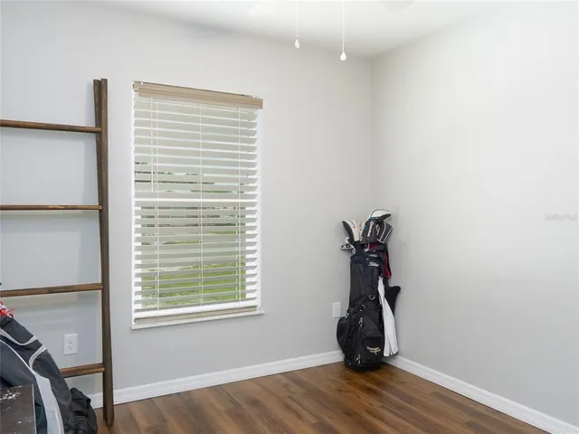 a view of a room with wooden floor and stairs