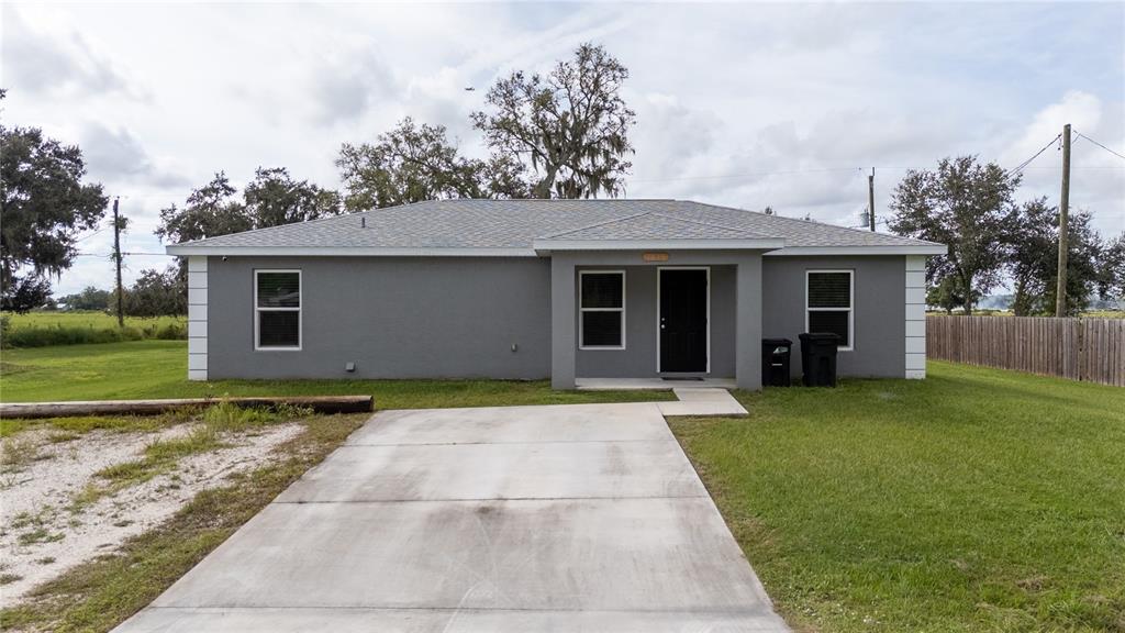 1833 Southeast Tangelo Drive Arcadia, FL 34266 - Photo 2 of 38 a view of a house with a garden