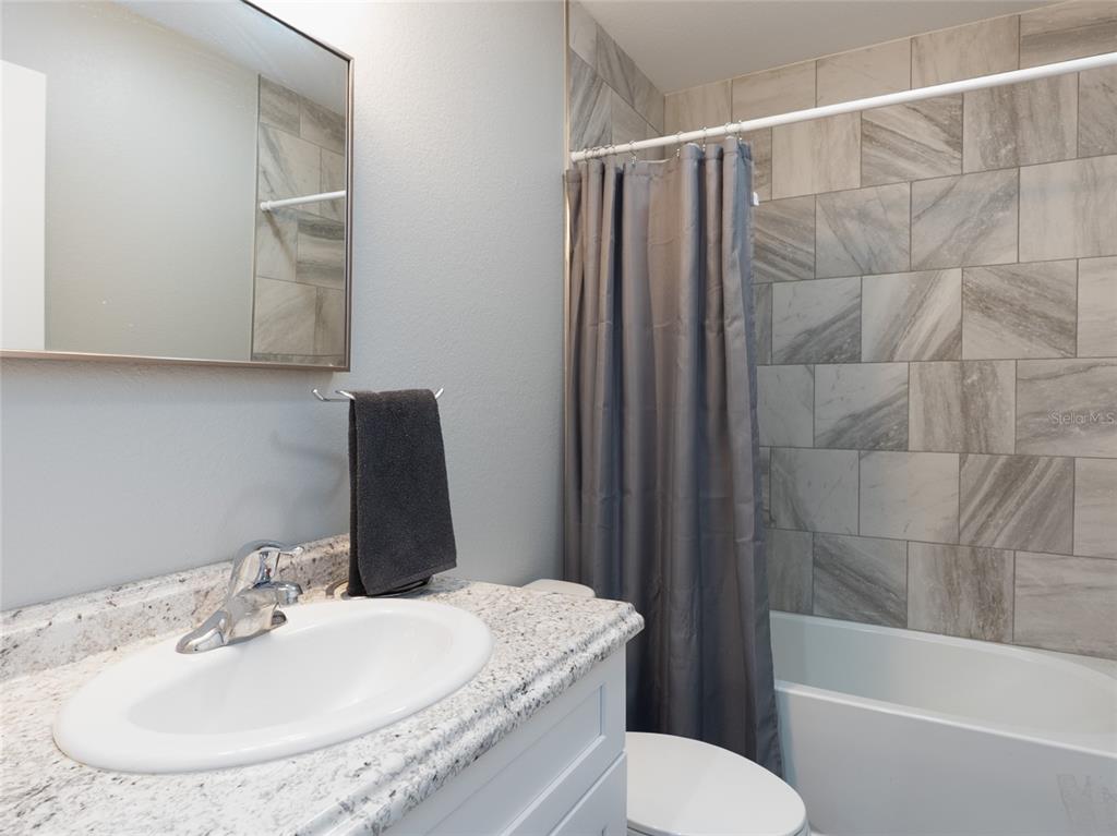 1833 Southeast Tangelo Drive Arcadia, FL 34266 - Photo 21 of 38 a bathroom with a sink toilet and shower