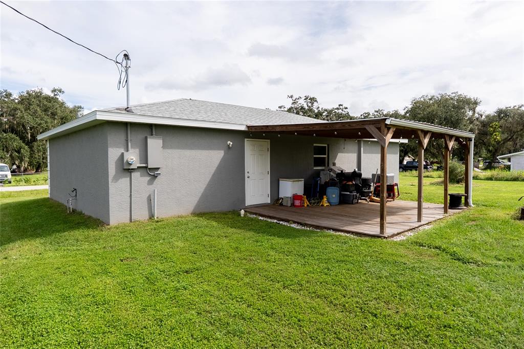 1833 Southeast Tangelo Drive Arcadia, FL 34266 - Photo 24 of 38 a view of a backyard with sitting area and slide