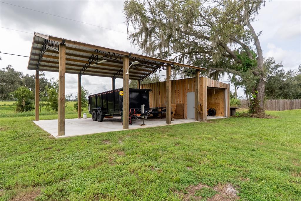 1833 Southeast Tangelo Drive Arcadia, FL 34266 - Photo 28 of 38 a view of a house with backyard porch and sitting area