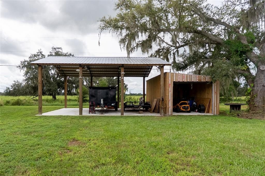 1833 Southeast Tangelo Drive Arcadia, FL 34266 - Photo 29 of 38 a view of a house with backyard porch and sitting area
