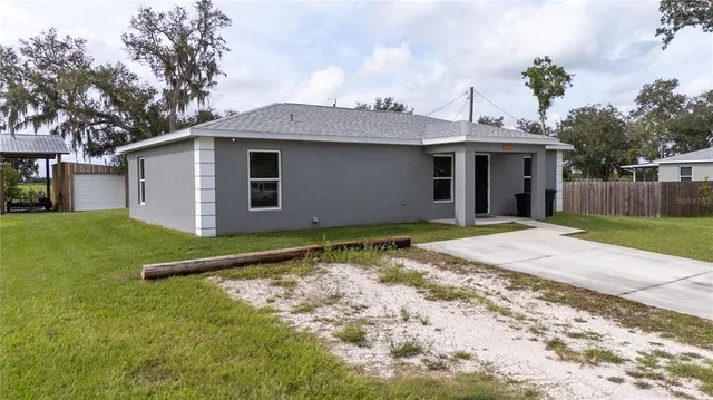a backyard of a house with lots of green space