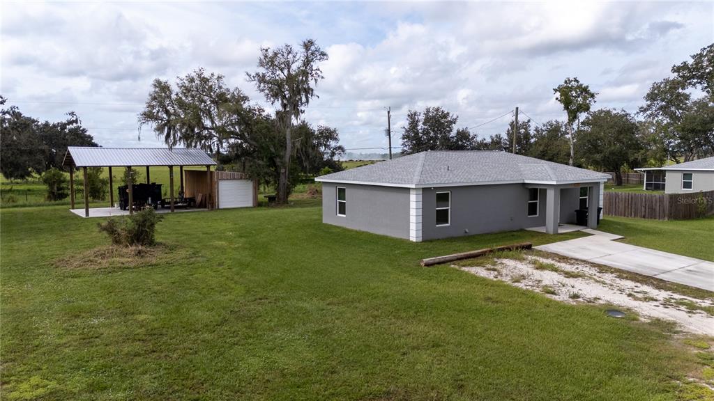 1833 Southeast Tangelo Drive Arcadia, FL 34266 - Photo 33 of 38 a view of a house with a yard