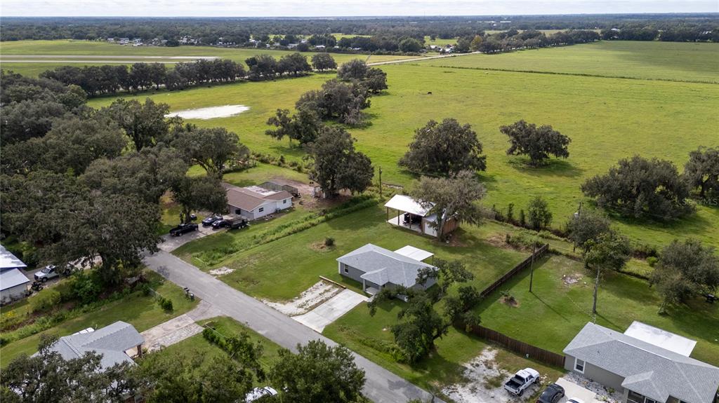 1833 Southeast Tangelo Drive Arcadia, FL 34266 - Photo 36 of 38 an aerial view of residential houses with outdoor space and lake view