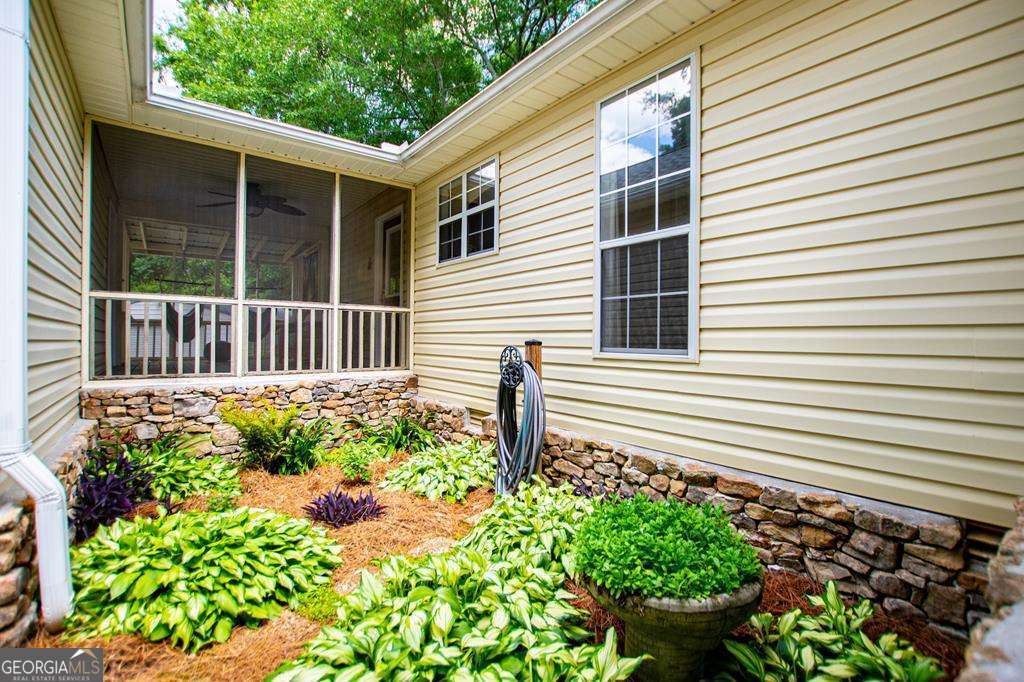 2 Pine Hill Drive Ranburne, AL 36273 - Photo 12 of 91 a front view of a house with a yard and a garden