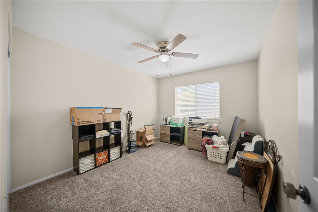 27879 Foxfire Street Menifee, CA 92586 - Photo 21 of 36 a living room with furniture and a window