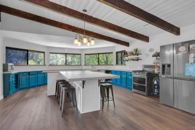 a kitchen with a sink and large window