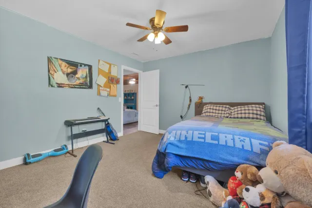 a bedroom with bed and furniture