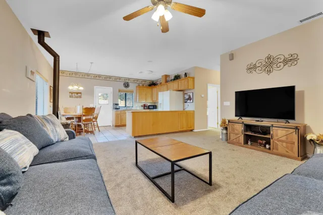 a room with furniture and flat screen tv