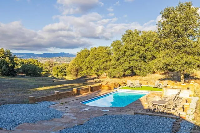 a view of a yard and an empty space