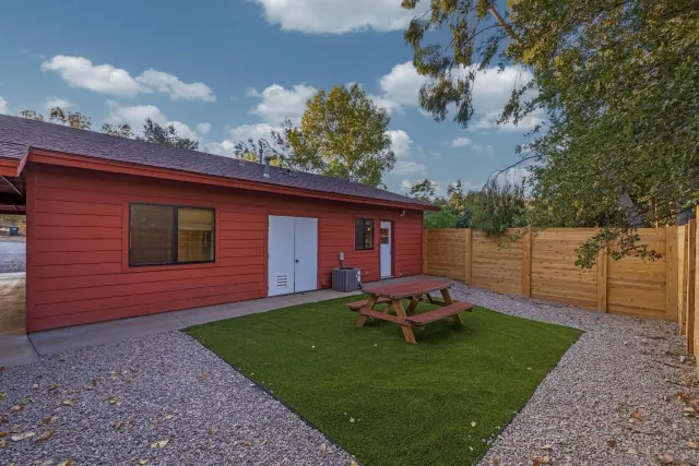 a view of a room with a wooden roof and windows
