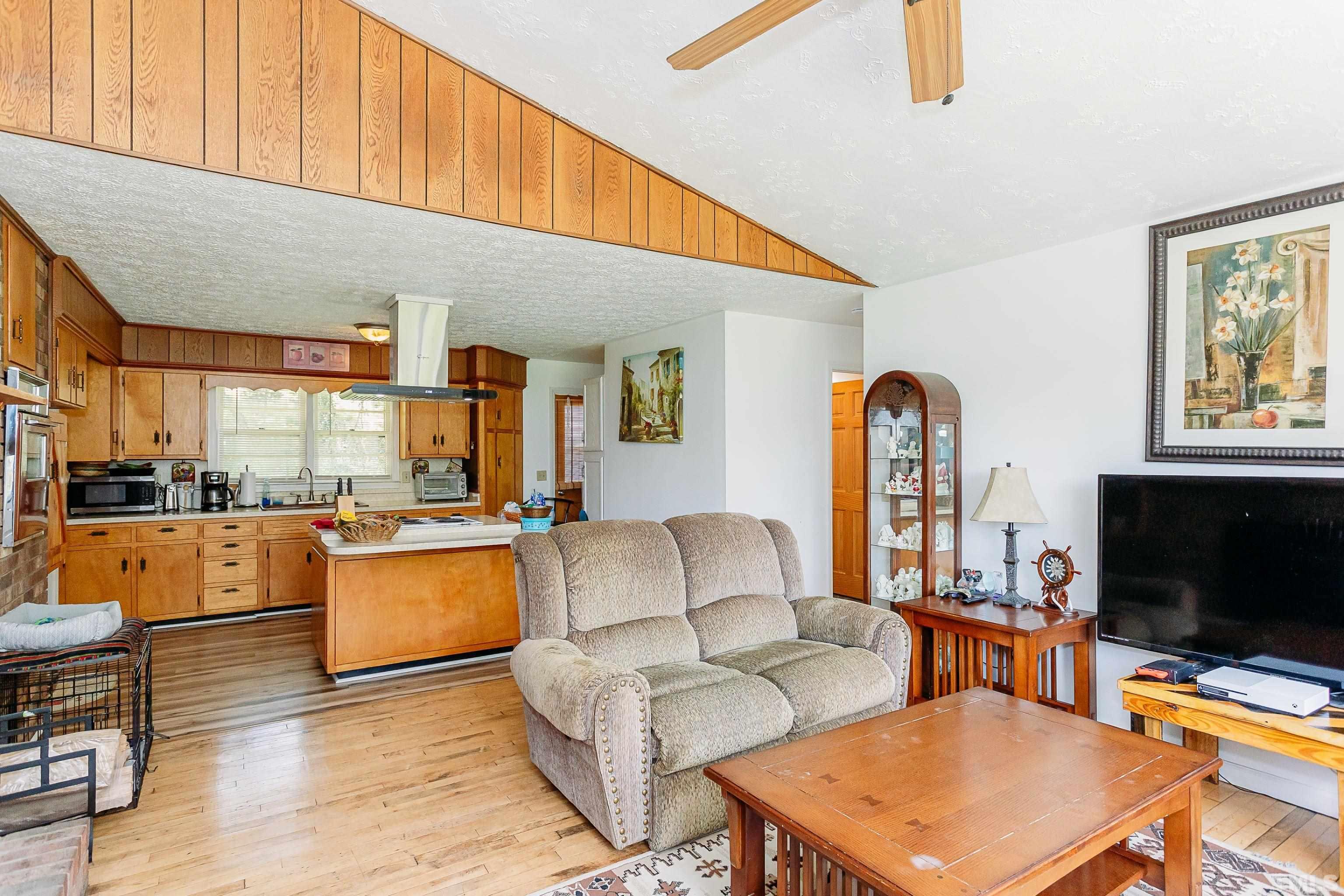 601 Fees Branch Road Lansing, NC 28643 - Photo 18 of 72 a living room with furniture a flat screen tv and kitchen view