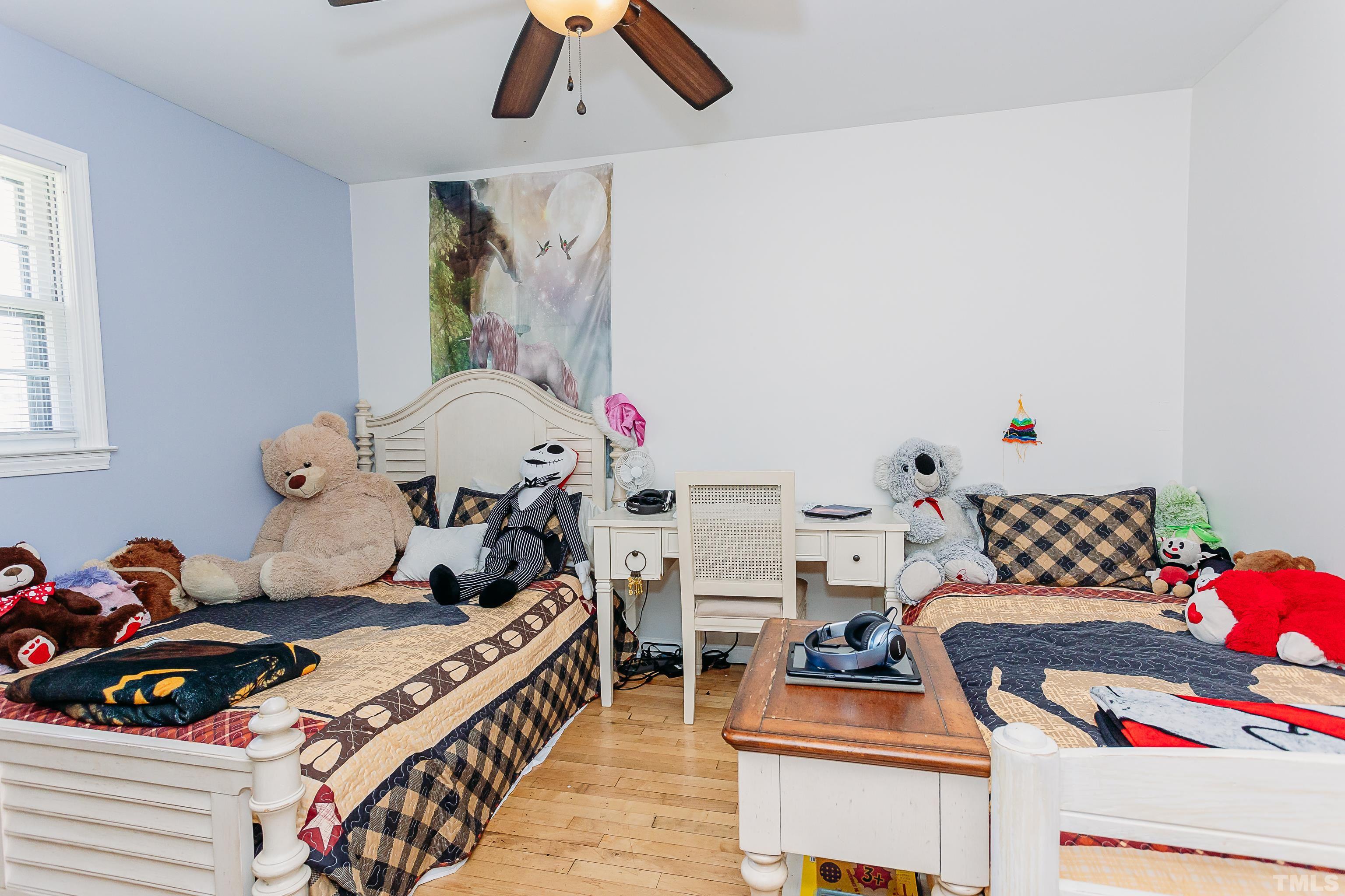 601 Fees Branch Road Lansing, NC 28643 - Photo 32 of 72 a bedroom with furniture and a baby crib