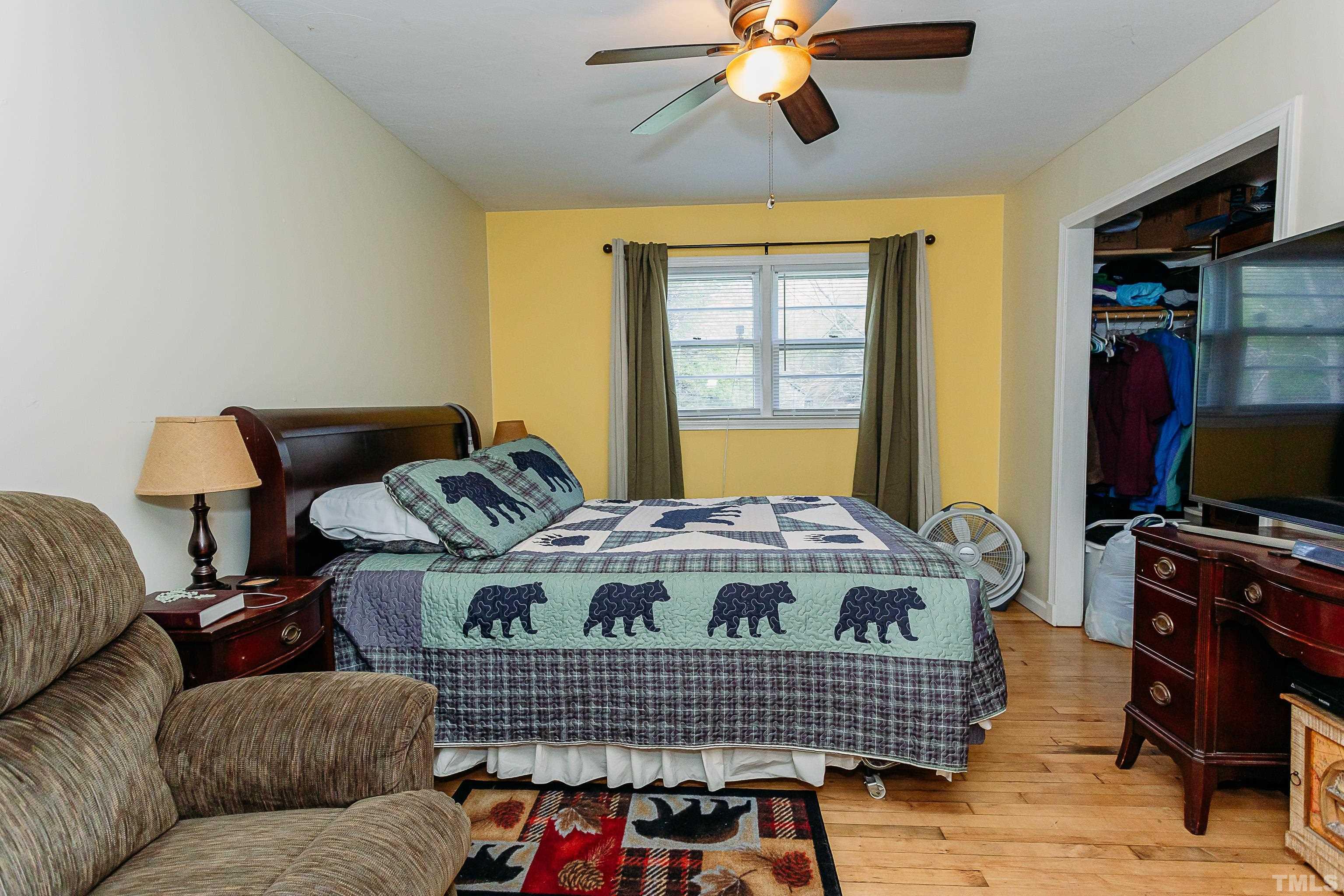 601 Fees Branch Road Lansing, NC 28643 - Photo 39 of 72 a living room with furniture a flat screen tv and a window