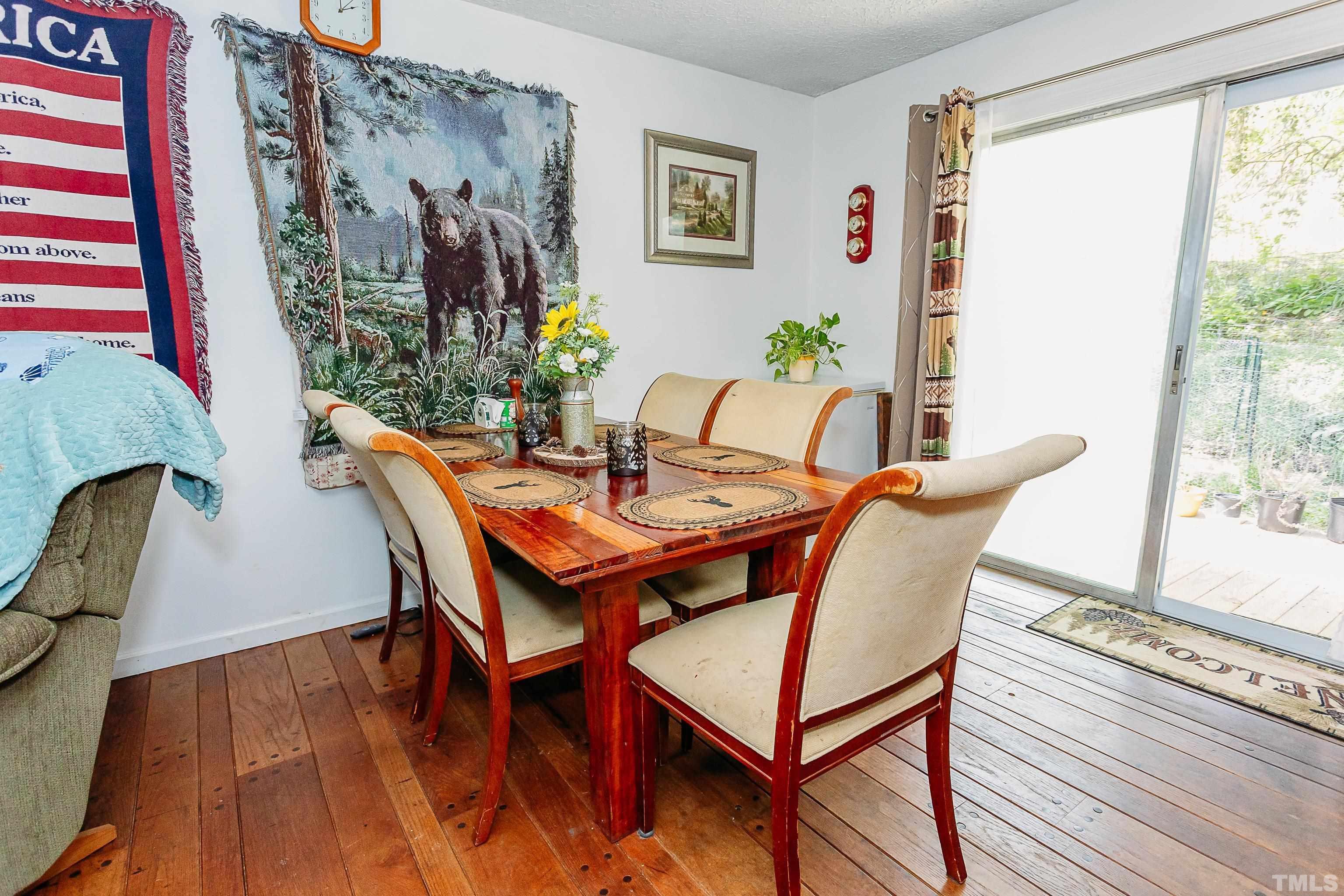 601 Fees Branch Road Lansing, NC 28643 - Photo 51 of 72 a view of a dining room with furniture window and wooden floor