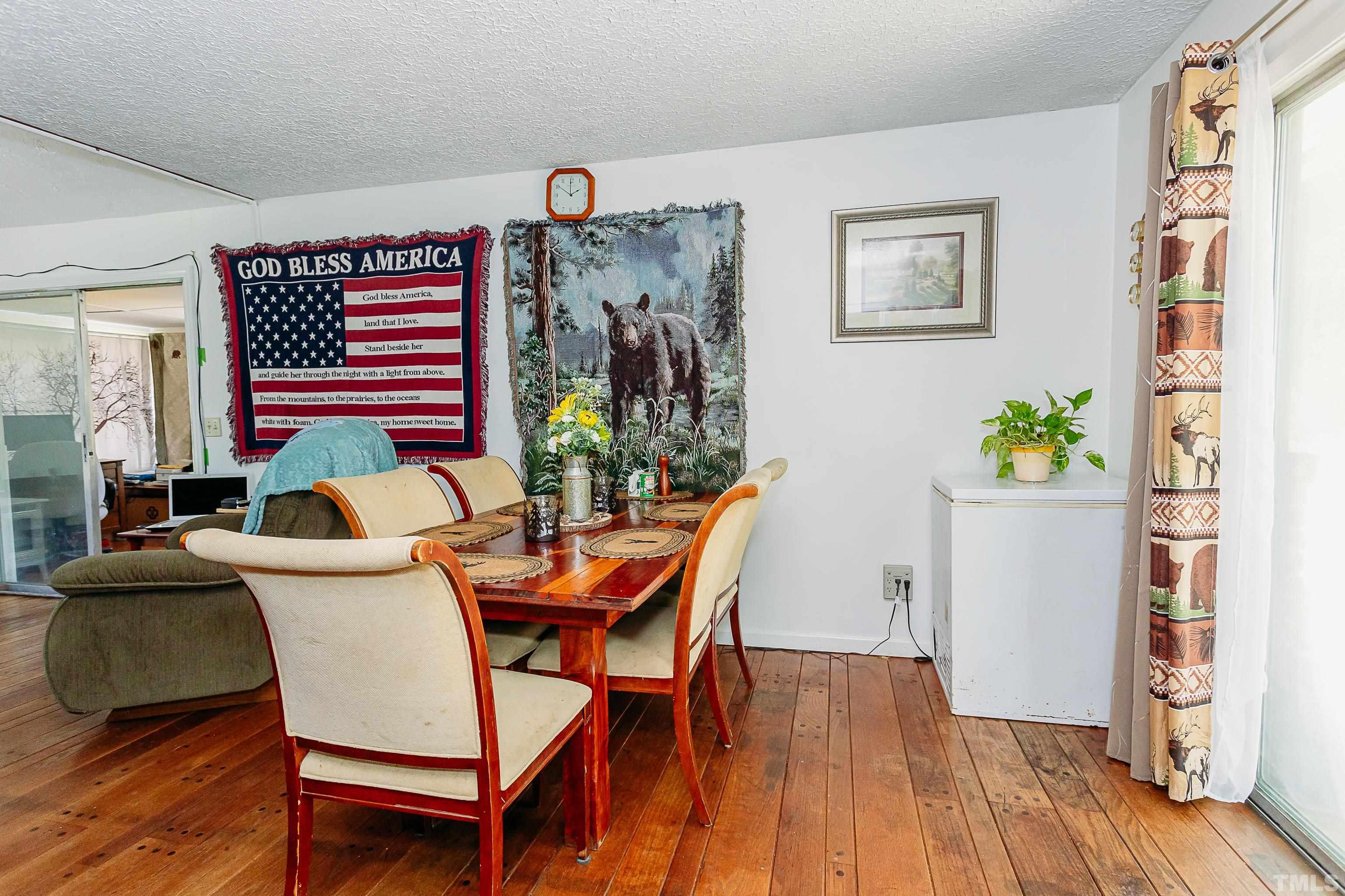 601 Fees Branch Road Lansing, NC 28643 - Photo 52 of 72 a dining room with furniture and wooden floor