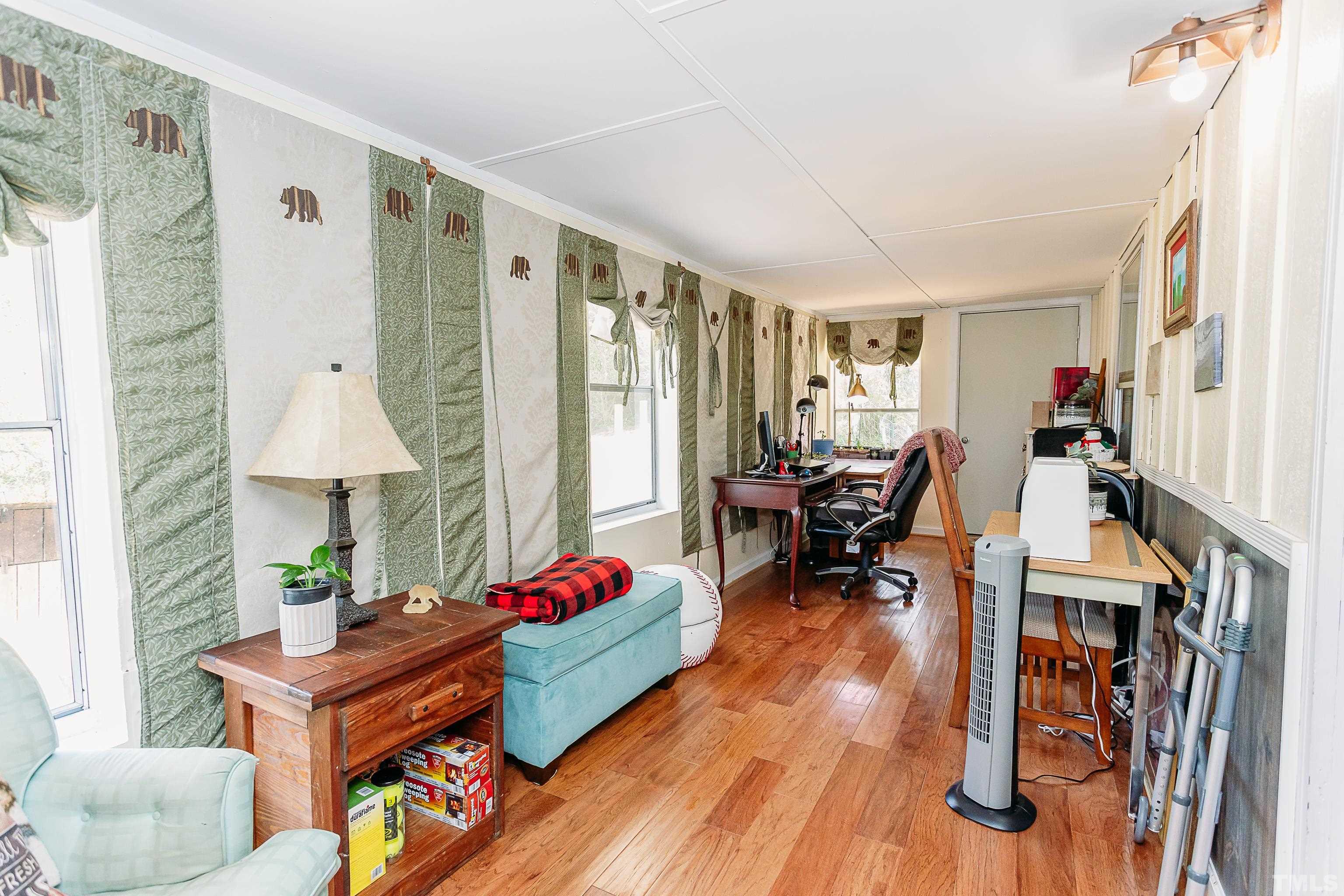 601 Fees Branch Road Lansing, NC 28643 - Photo 56 of 72 a living room with furniture and wooden floor