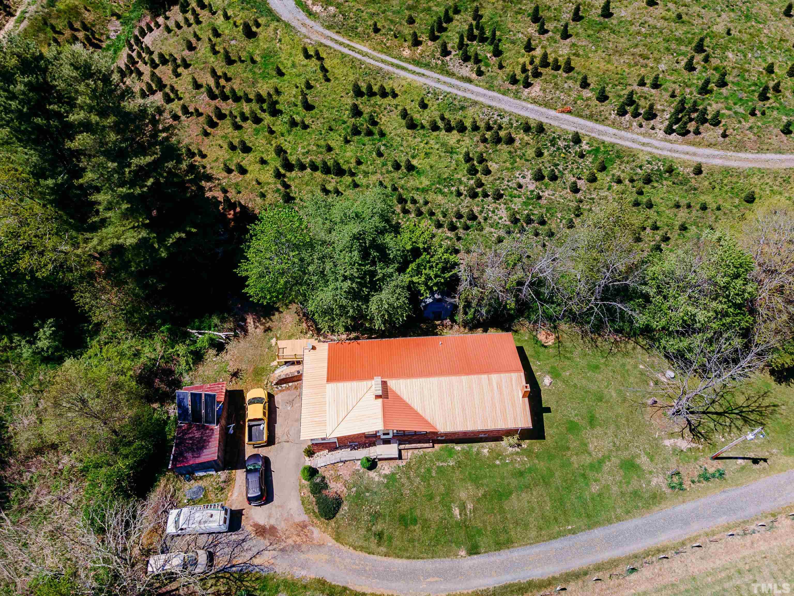 601 Fees Branch Road Lansing, NC 28643 - Photo 61 of 72 an aerial view of a house with a yard and lake