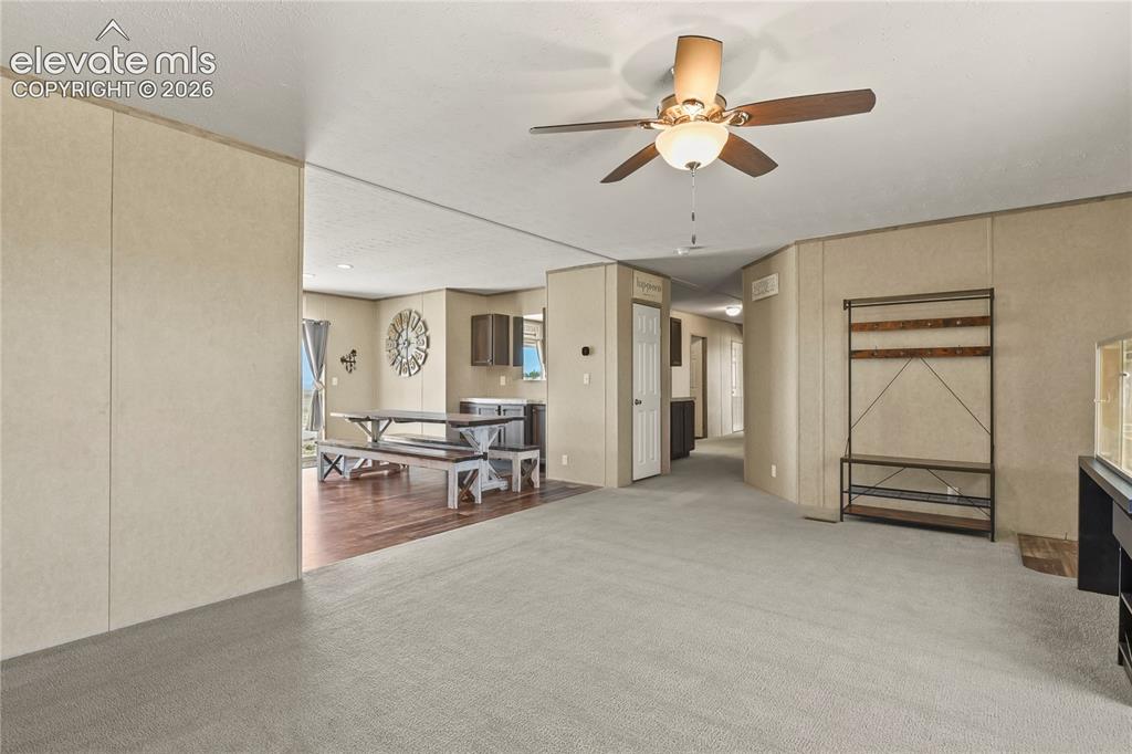 22280 Jones Road Peyton, CO 80831 - Photo 6 of 47 a view of a livingroom with a furniture and a ceiling fan