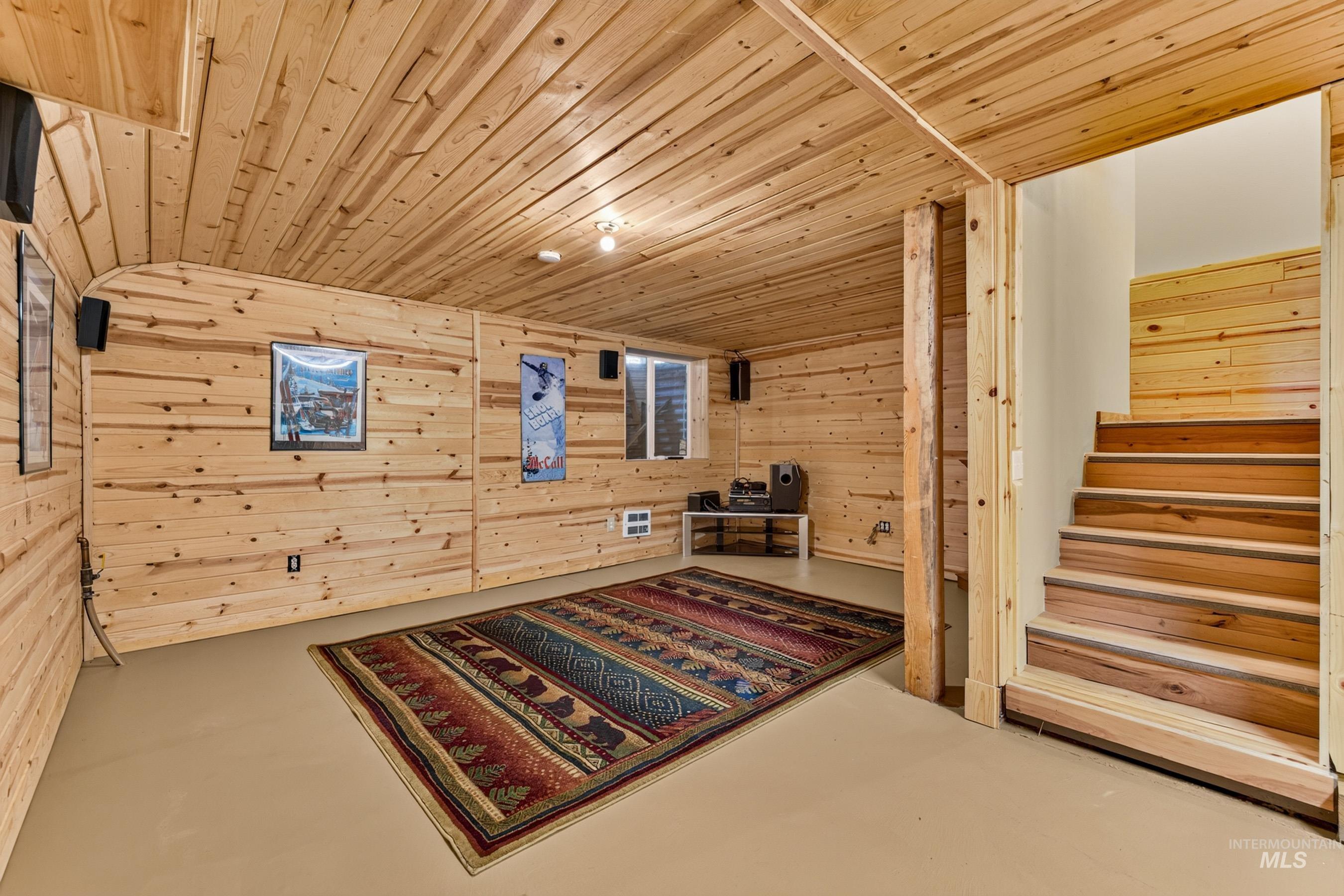 3531 Kp Cove Road McCall, ID 83638 - Photo 32 of 49 Hardwood flooring, light-colored walls, wood-trimmed windows, and a flush mount ceiling light