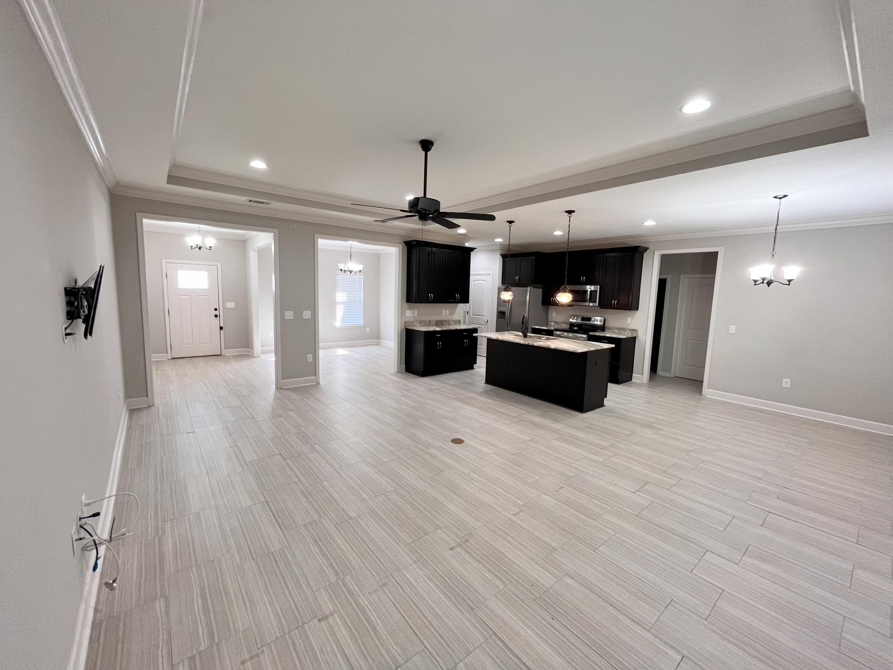5182 Rabbit Run Crestview, FL 32539 - Photo 21 of 35 a living room with furniture and wooden floor