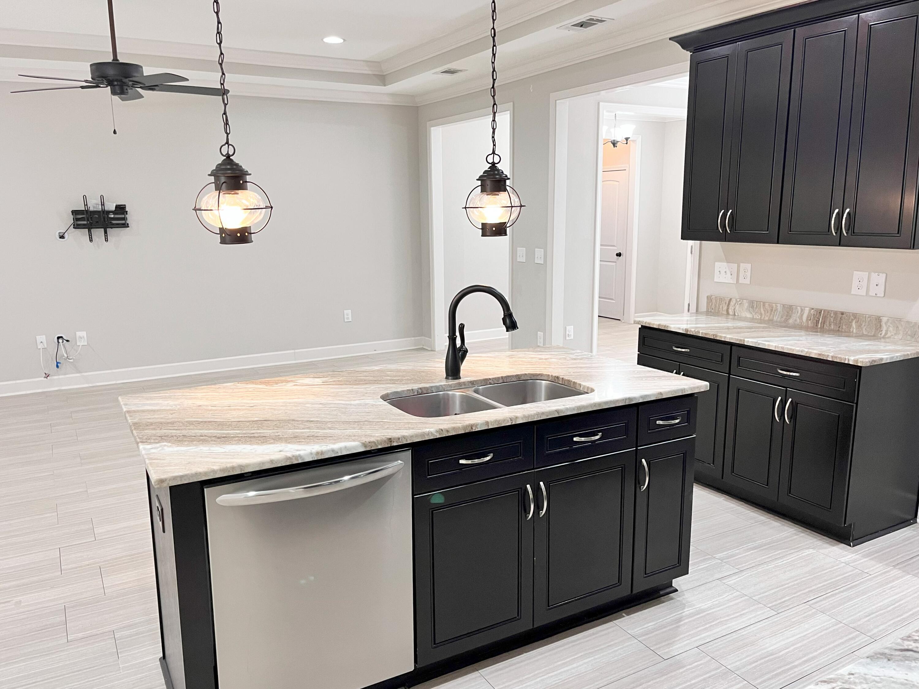 5182 Rabbit Run Crestview, FL 32539 - Photo 24 of 35 a kitchen with a sink and dishwasher