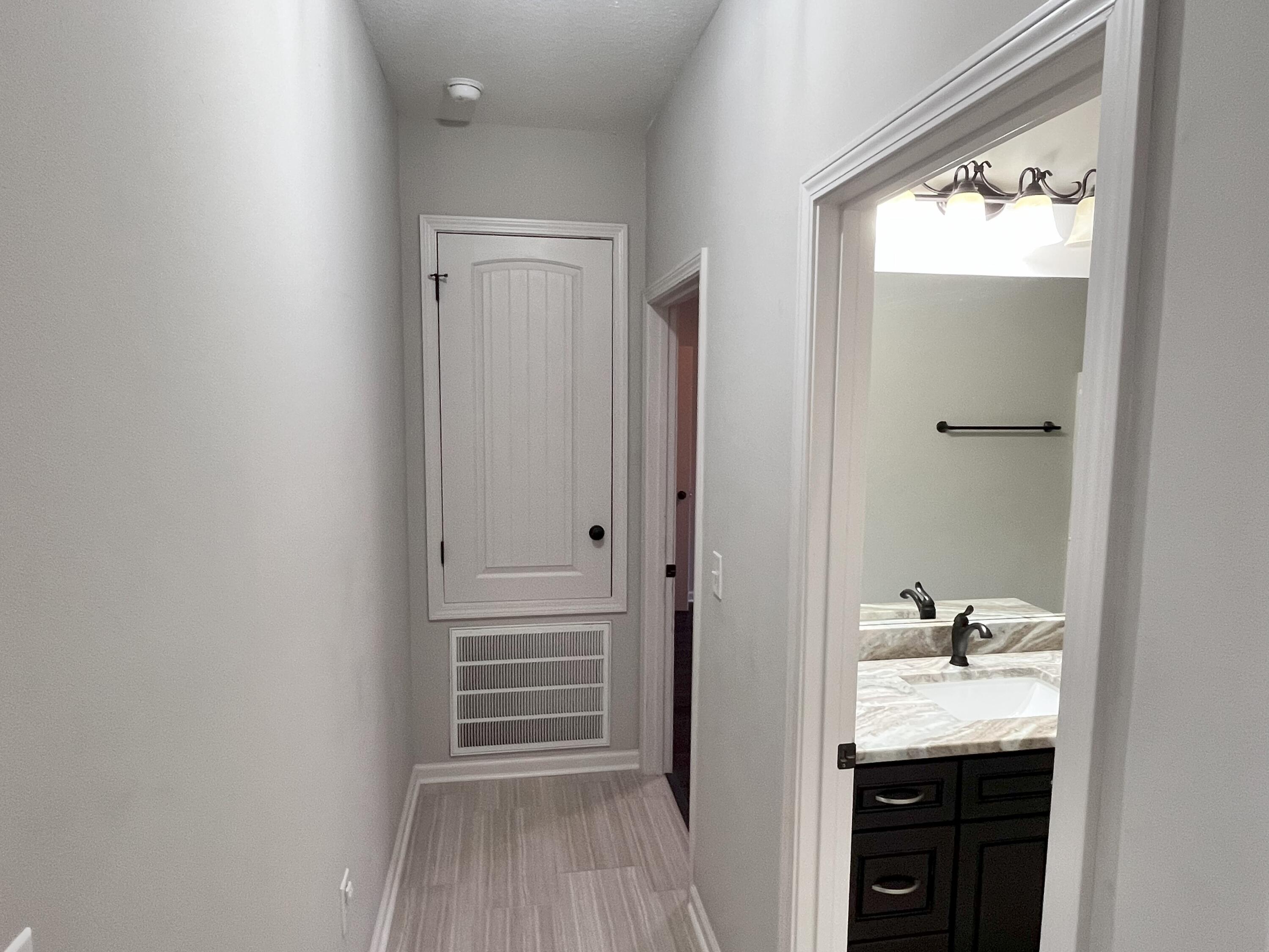 5182 Rabbit Run Crestview, FL 32539 - Photo 29 of 35 a bathroom with a granite countertop sink and a mirror